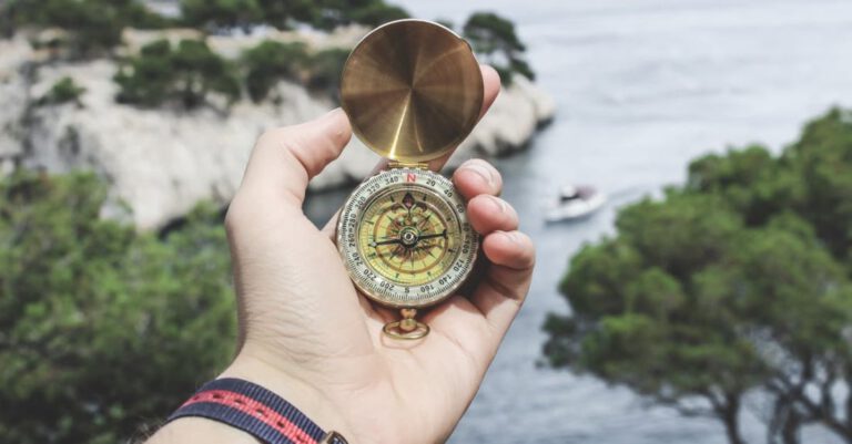 Tour - Person Holding Compass