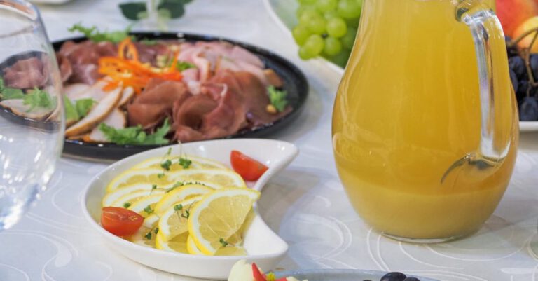 Cheeses - Jug of Juice and Plates of Food on a Decorated Table