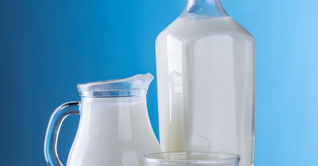 Dairy - Close-up of Milk Against Blue Background