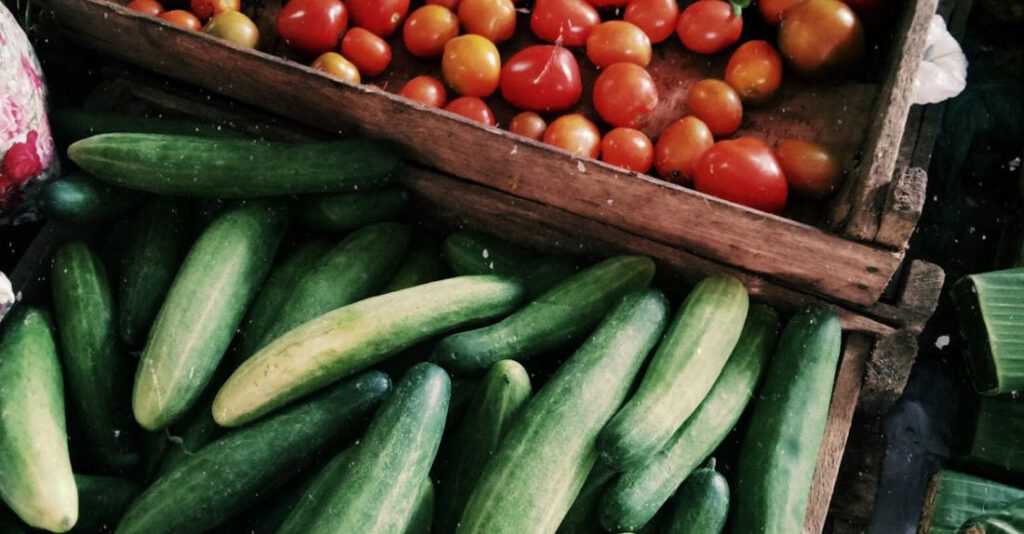 Produce - Photo of Cucumbers and Tomatoes in Wooden Crates