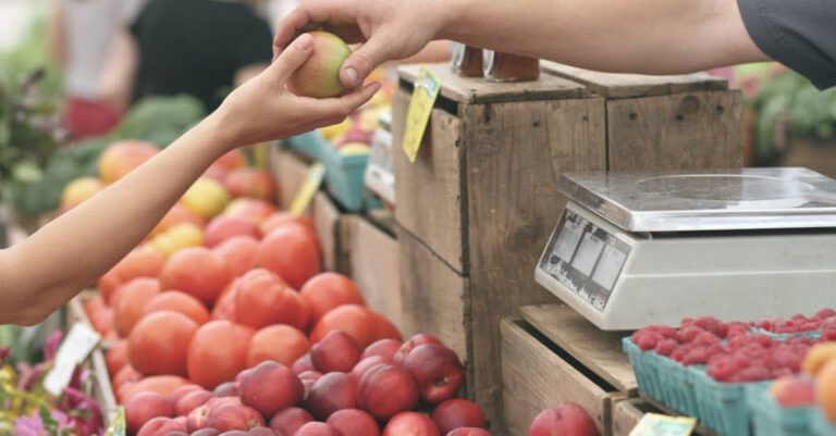 Markets - Person Giving Fruit to Another