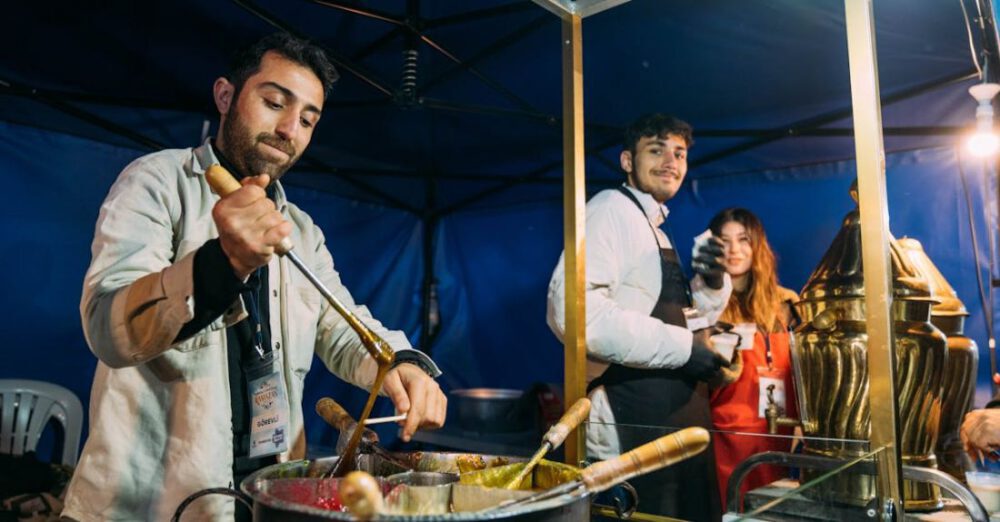 Vendors - A man cooking food at a food stand