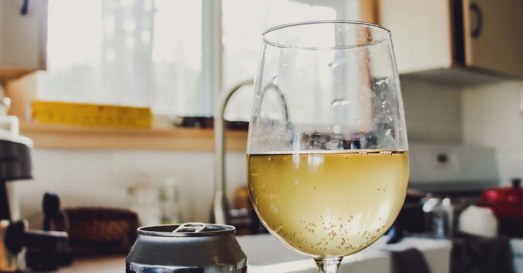 Cider - Wine Glass with Yellow Liquid